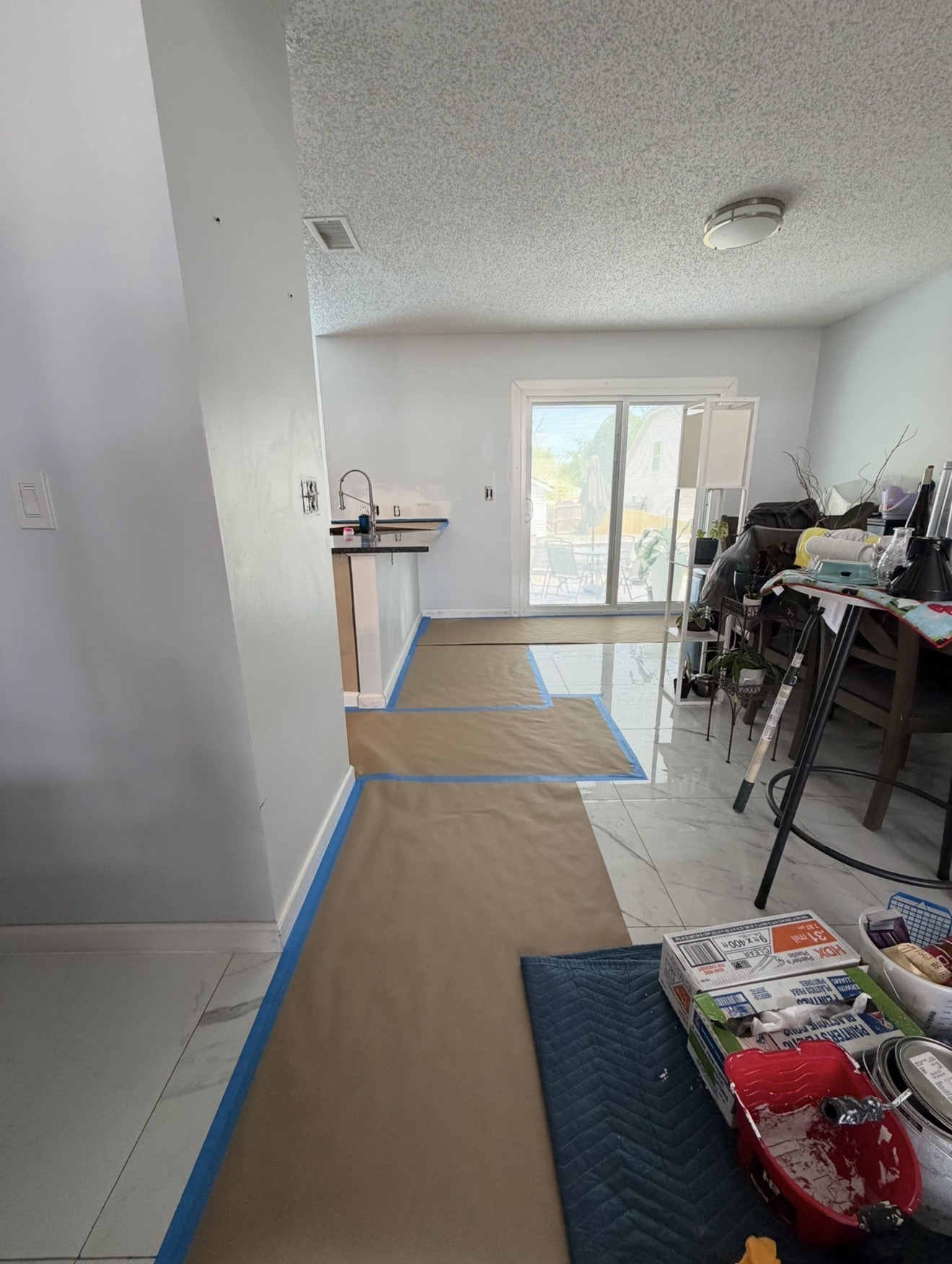 Floors and baseboards masked before painting